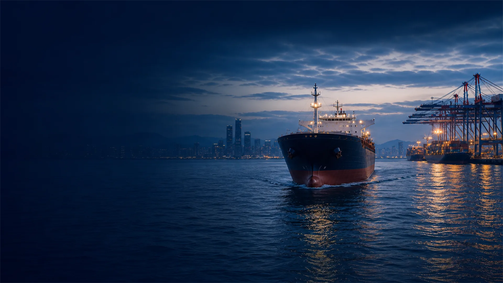 Vessel approaching a container port at blue hour